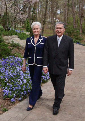 Ellen and Don Edmondson walking along flowering path in Garvan Woodland Gardens