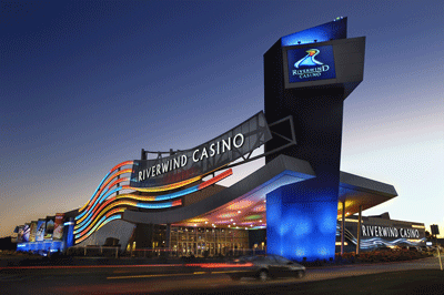 photograph of Riverwind Casino, glowing at dusk.