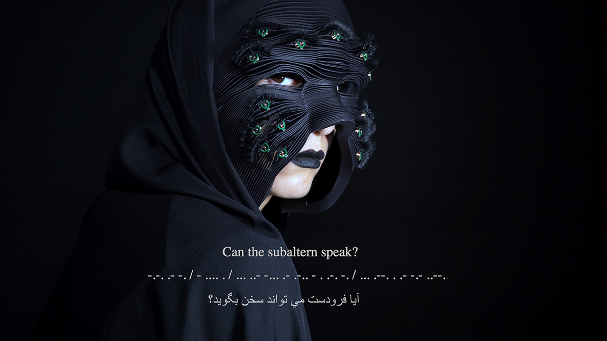 Woman looks at the camera while wearing a black, layered mask. Words on the image: "Can the subaltern speak?"